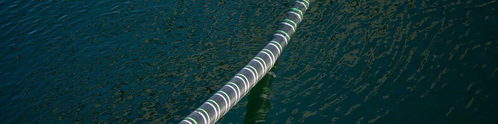 Cable Hanging Over Sea Water