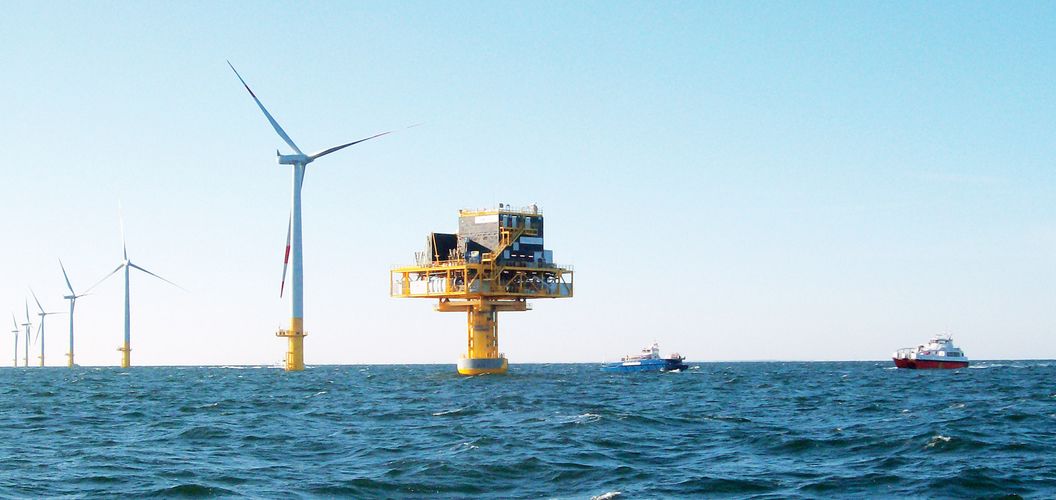 Triton Knoll offshore wind park with turbines and substation during sunny weather