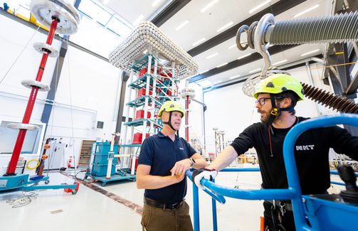 two engineers in HV test hall