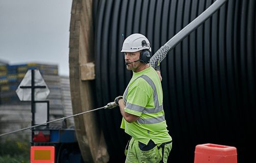 NKT worker installing HV cable